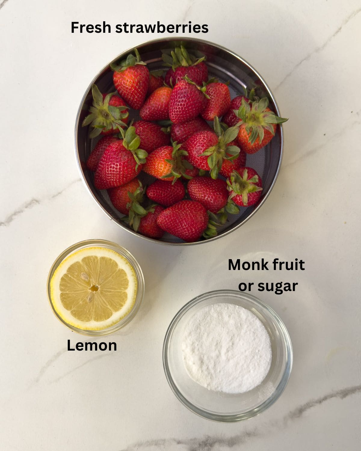 Three simple ingredients for making a strawberry coulis with lemon.