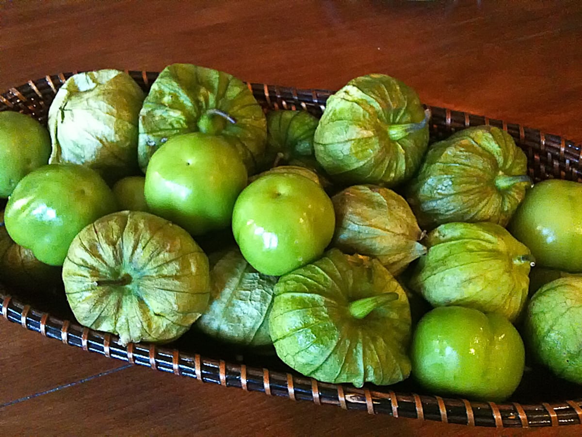 Basket of green tomatillos.