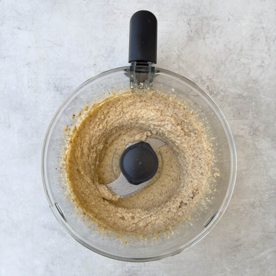 Making the cake batter, ground almonds and lemon in a food processor workbowl.