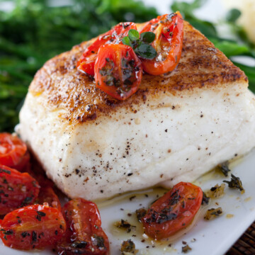 Roast halibut with tomatoes.