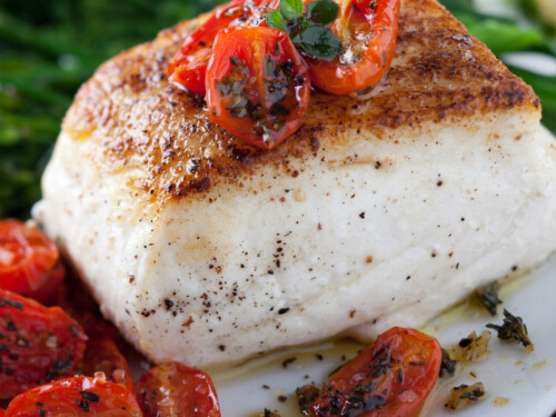 Roast halibut with tomatoes.