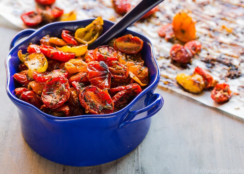 Herb Roasted Cherry tomatoes in a blue bowl.