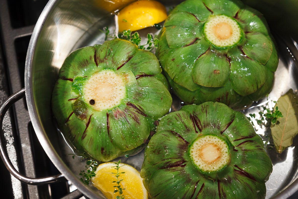 Bright green artichokes in a pan