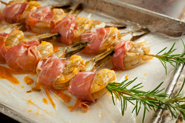 Raw shrimp wrapped with prosciutto.