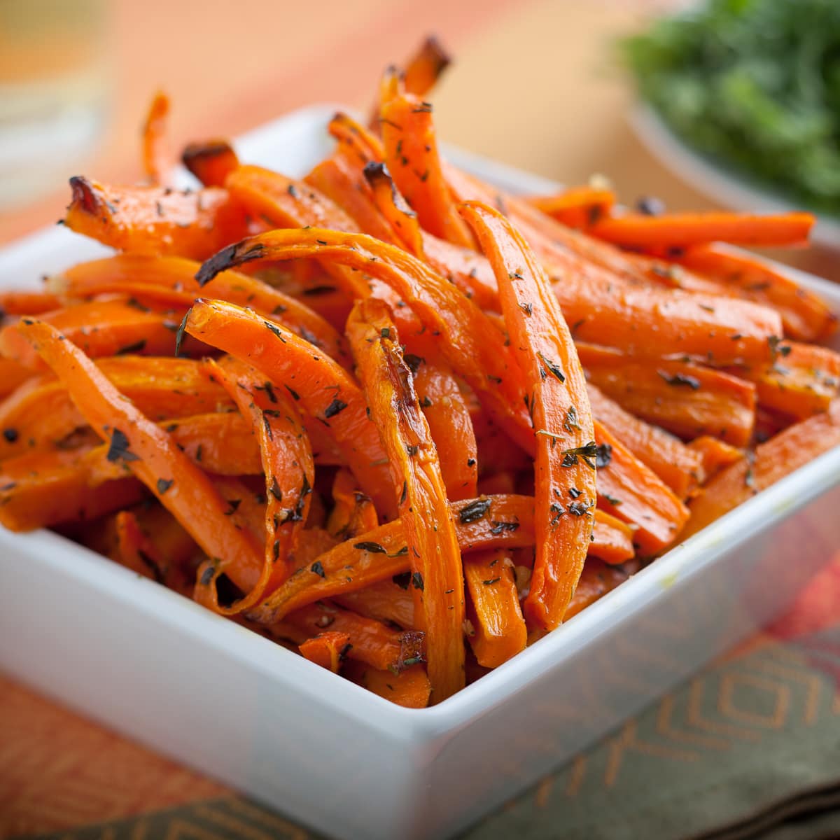 close up of roasted carrots with thyme.