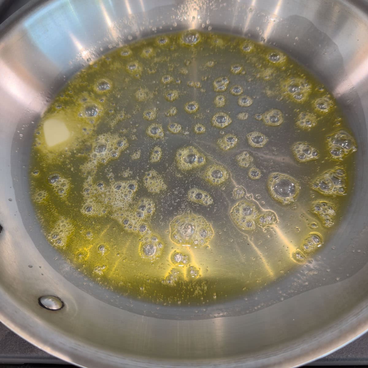 Heat the oil and butter in a 12" frying pan.