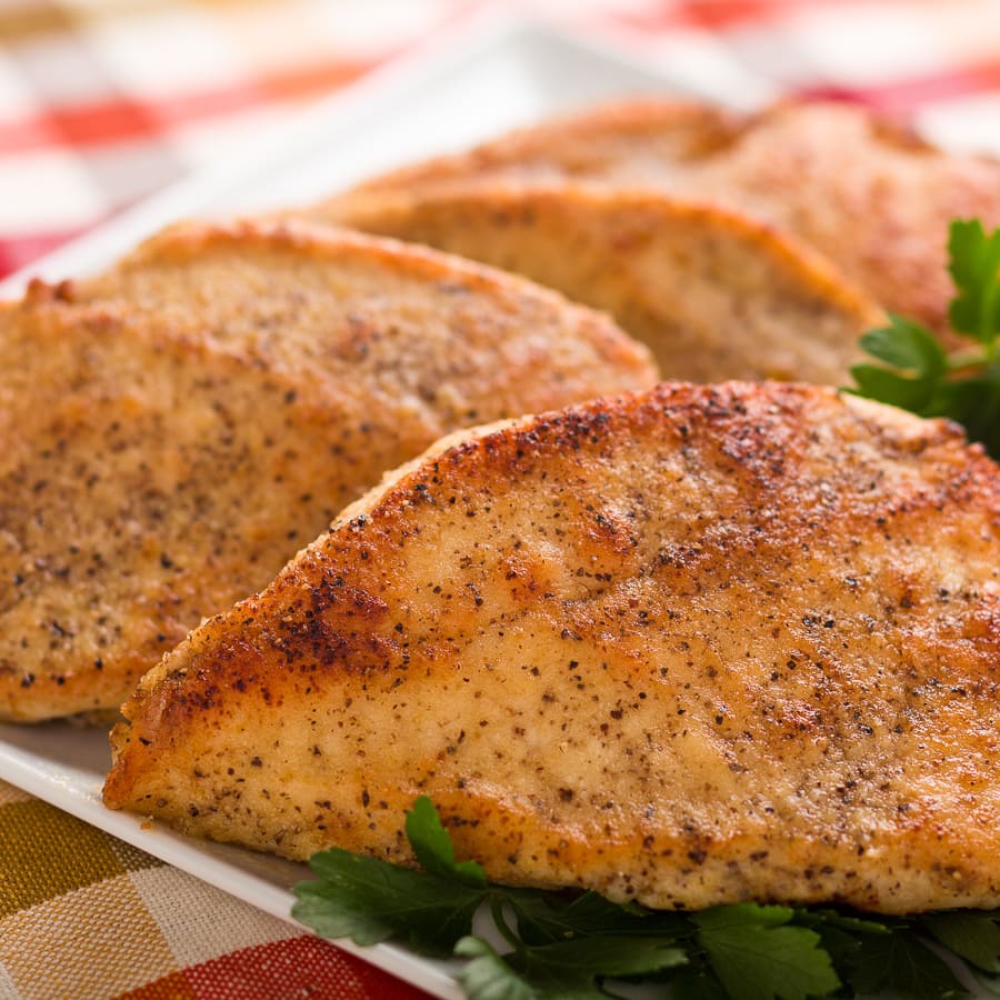 slicing chicken breast into cutlets