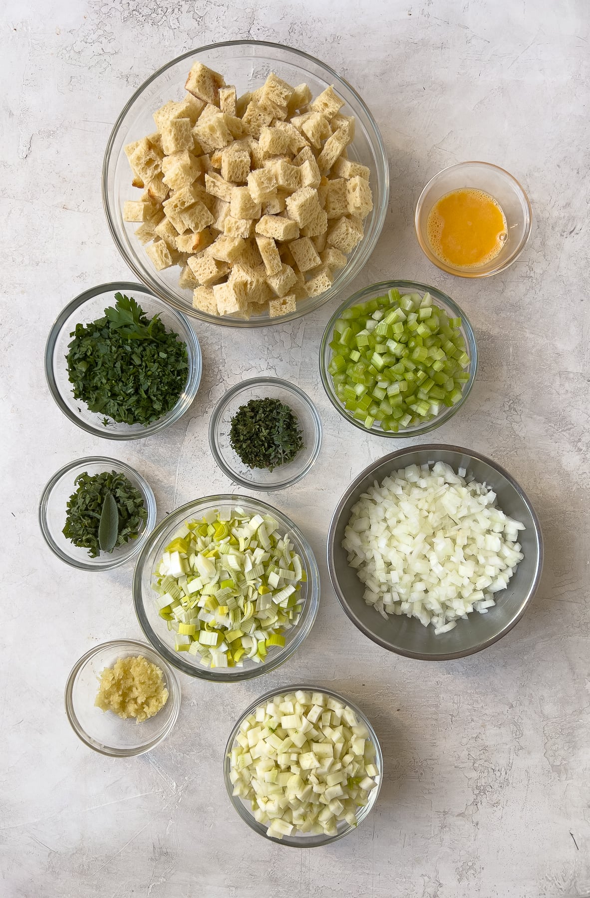 Prepped stuffing ingredients in bowls, ready to cook.