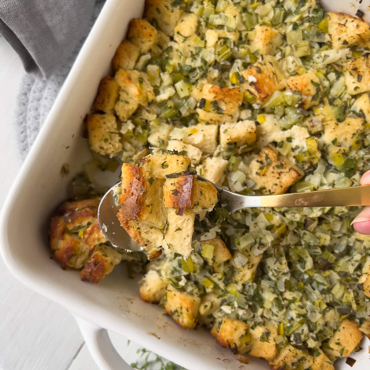 Golden Thanksgiving stuffing on a spoon.