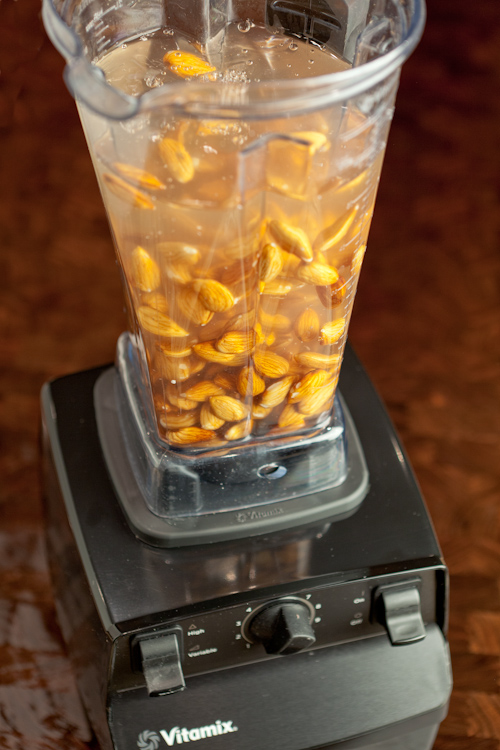 Raw soaked almonds in a blender.