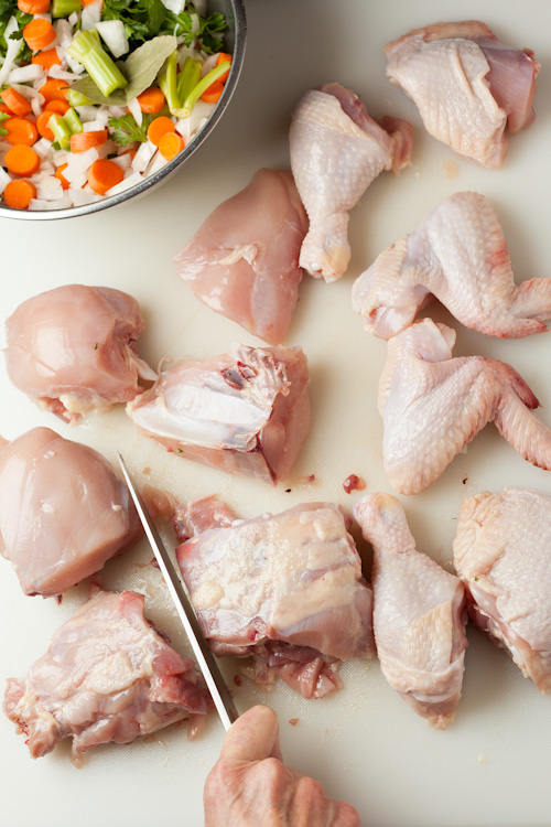 Cutting up chicken for broth | AFoodCentricLife.com