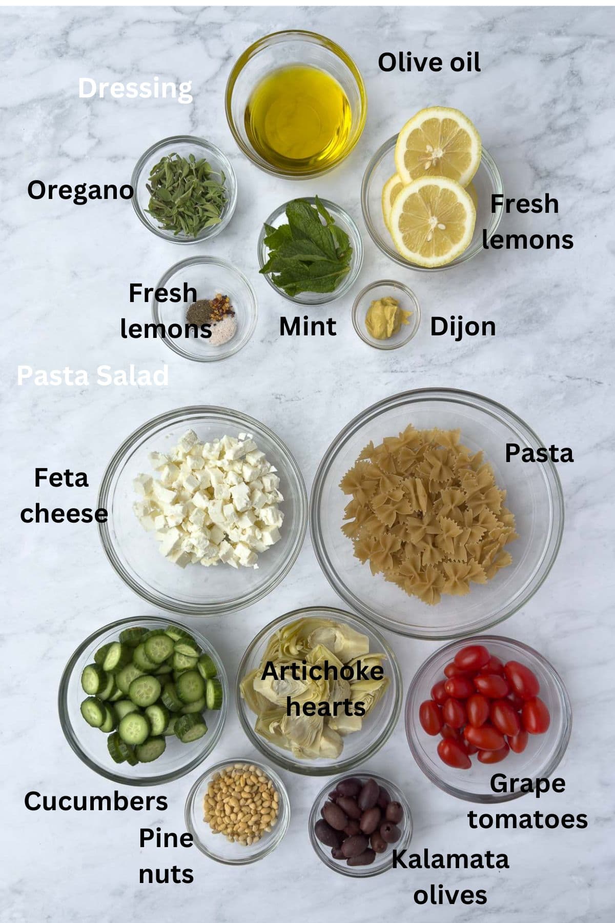 Dressing and salad ingredients for Mediterranean pasta salad. 