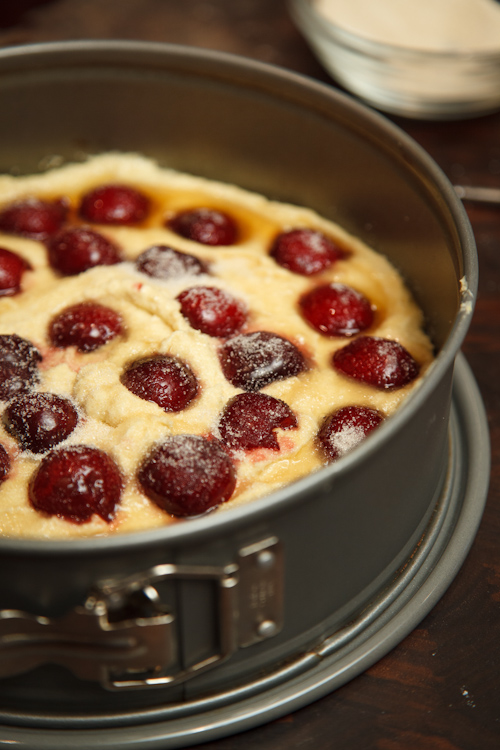 Batter in pan with cherries added.