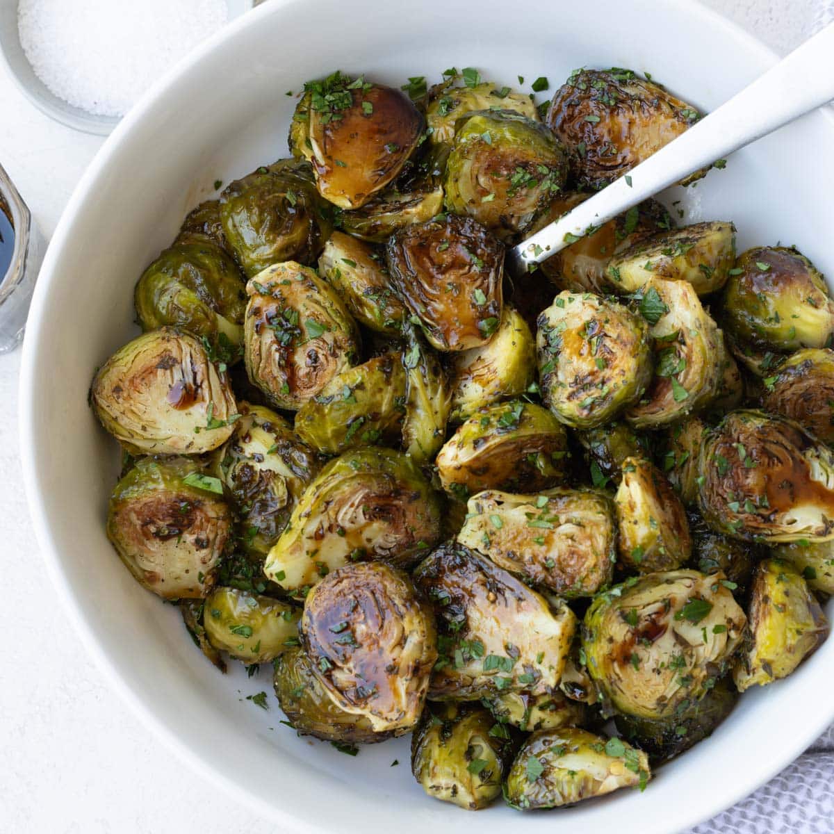 A bowl of burnished roasted Brussels sprouts glazed with Balsamic.