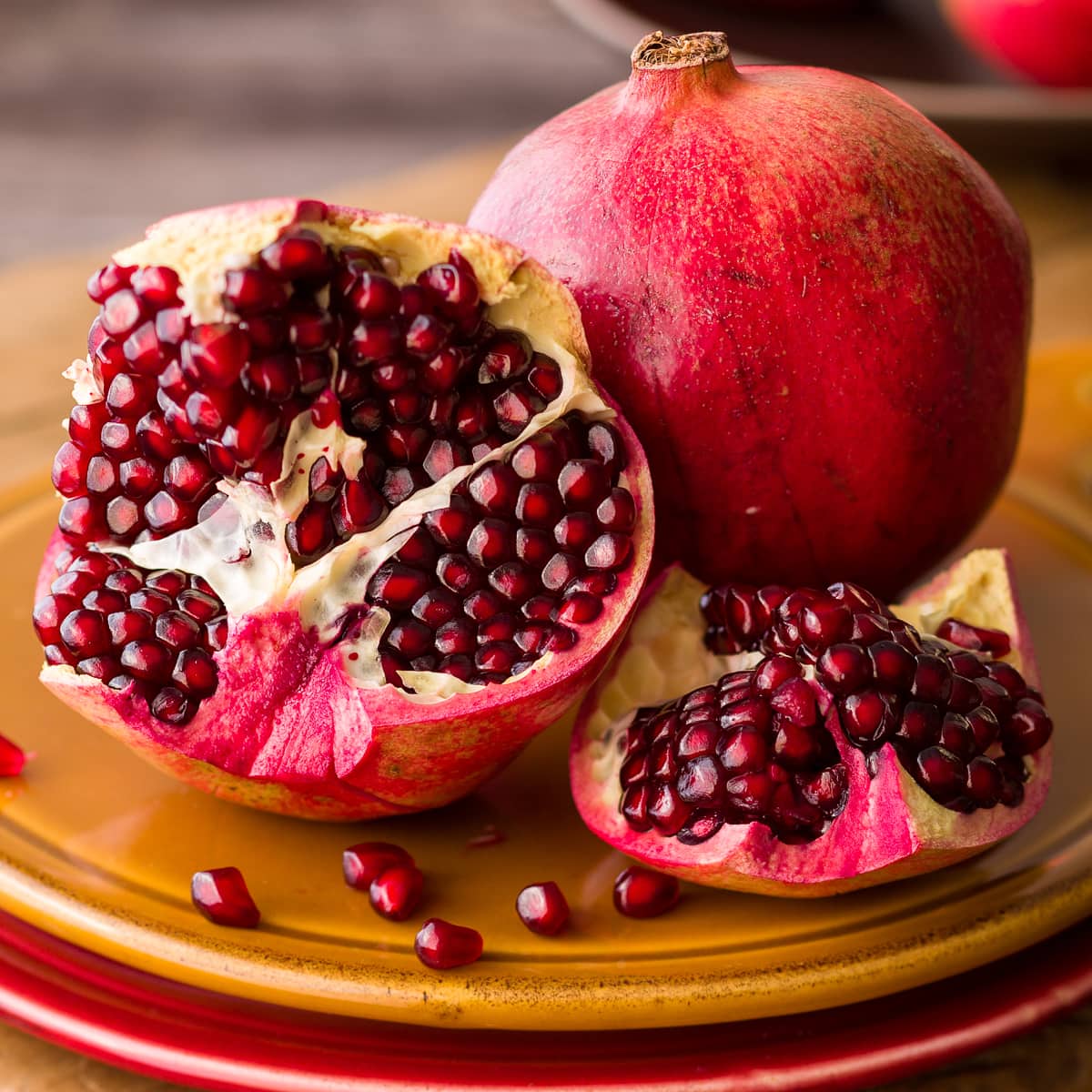 Beautiful ruby red pomegranate fruit cut open.