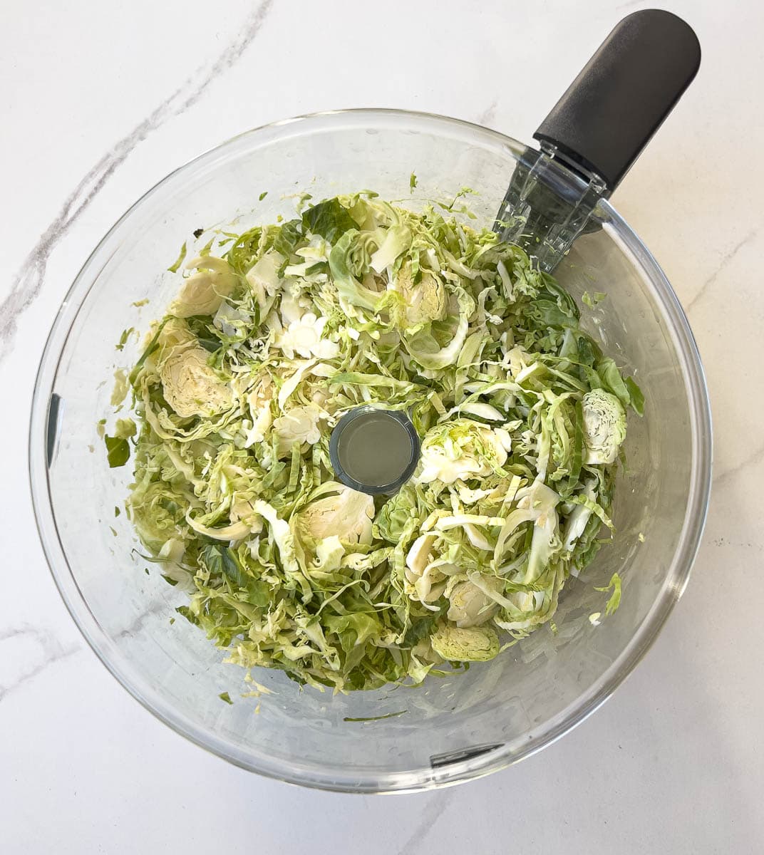 Shaved brussels sprouts in food processor