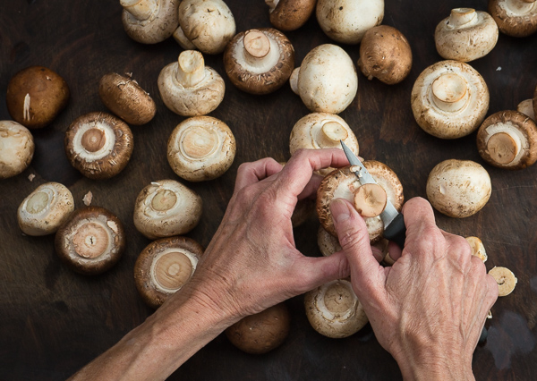 Trimming mushrooms.