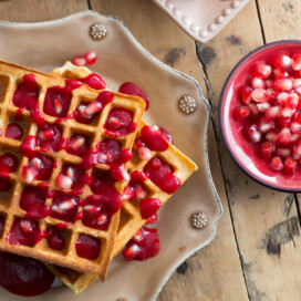 waffles with raspberry sauce and pomegranates