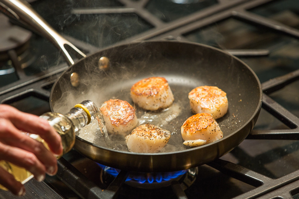 Turn the scallops over, add wine, they finish quickly.