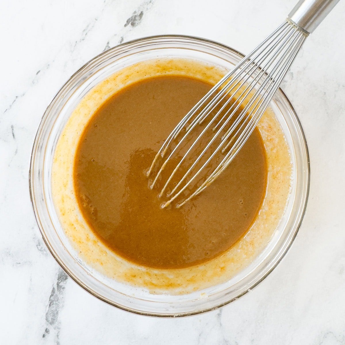 Golden brown, creamy almond butter dipping sauce blended smooth with a whisk and ready to use. 
