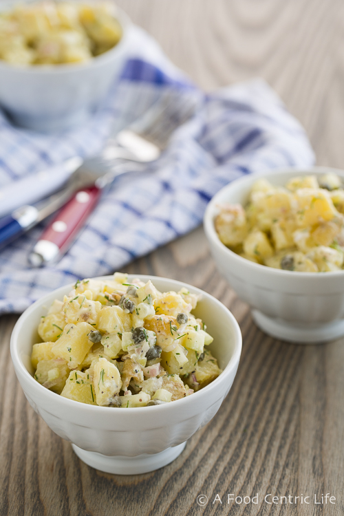 Small bowl of finished potato salad, ready to eat. 
