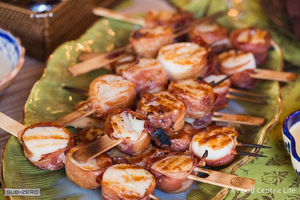 Grilled scallops wrapped with Prosciutto on bamboo skewers.