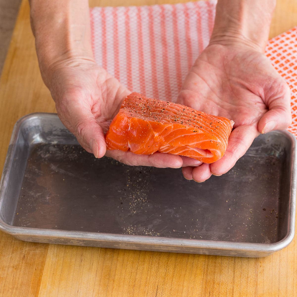 Folded salmon creates a more even piece of fish for cooking.