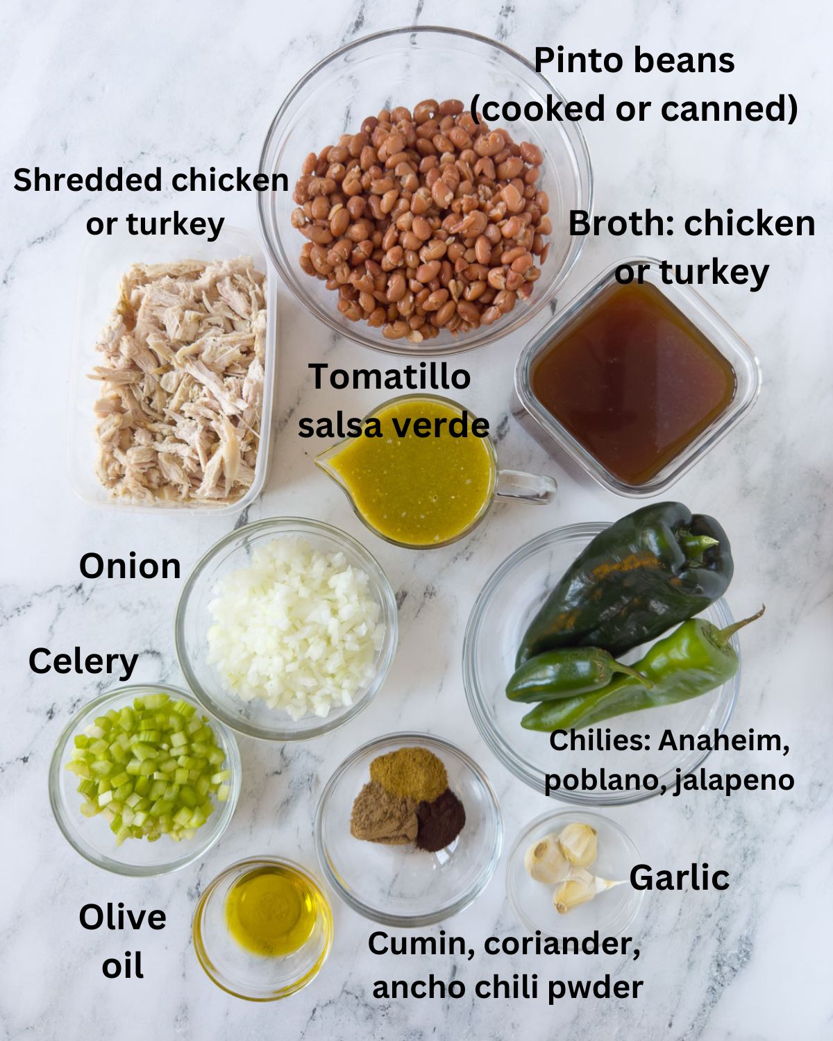 Ingredients for tomatillo soup in prep bowls, pinto beans, broth, spice, onion, chicken and chilies.
