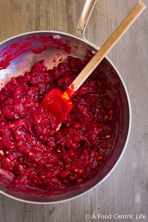 cranberry sauce cooking in a pan.