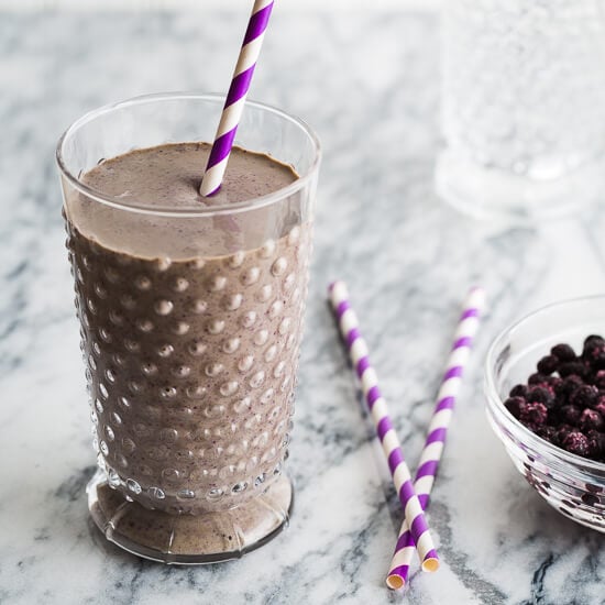 A chocolate blueberry smoothie in a glass