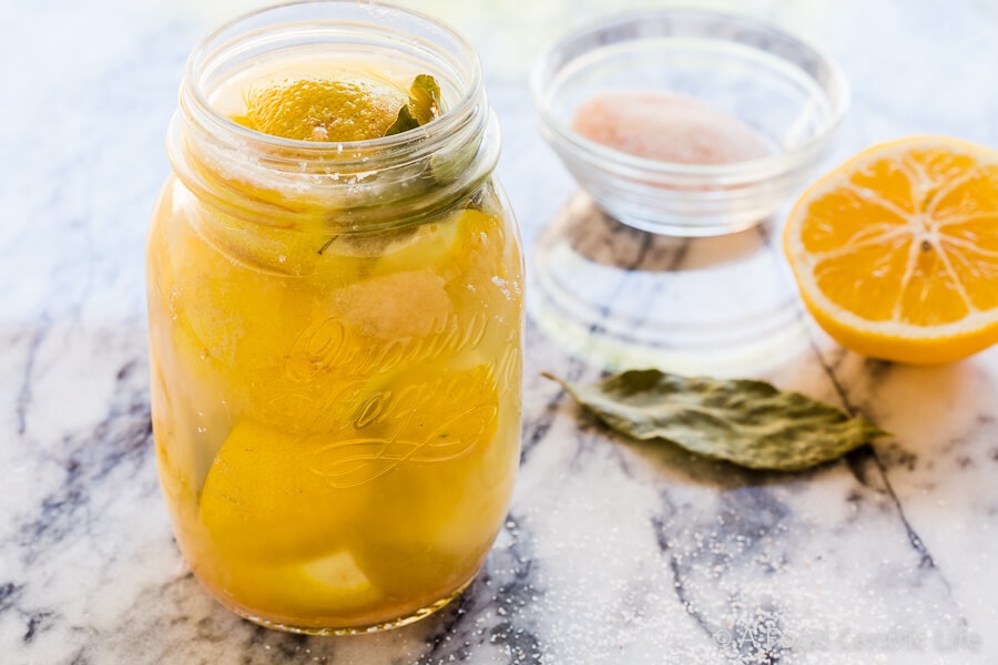 Making a jar of preserved lemons.