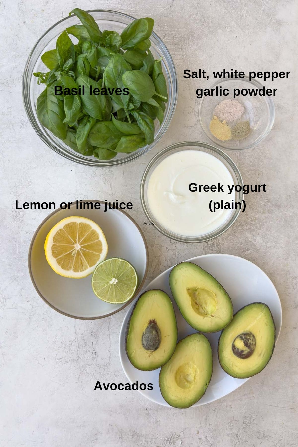 Ingredients for creamy avocado dip with basil.