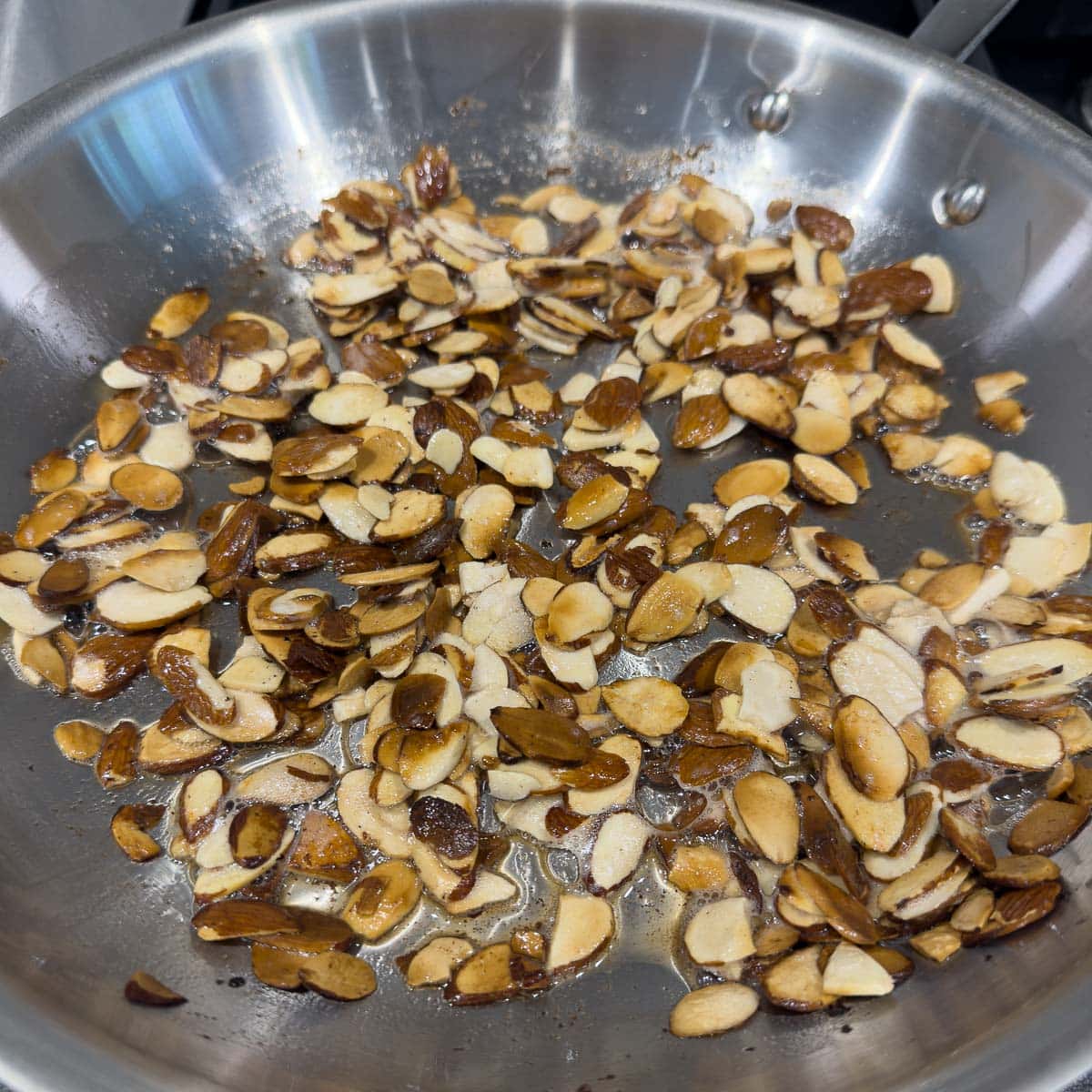 Golden brown butter toasted almonds in the pan, finished. 