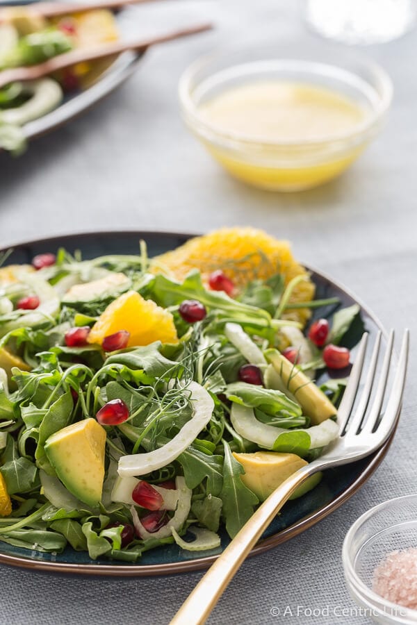 Fennel and arugula salad with avocado, orange and pomegranate seeds.