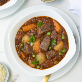 A hearty bowl of beef stew with vegetables.