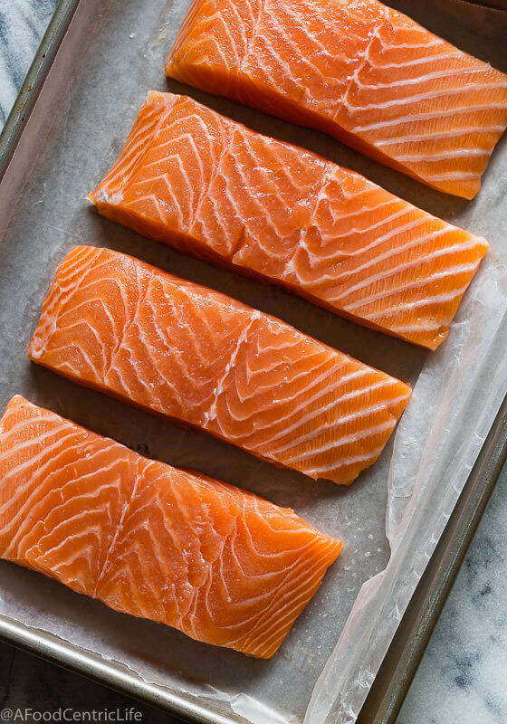 raw salmon filets on a tray | AFoodCentricLife