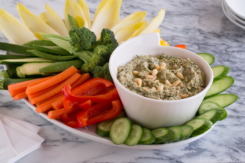 Platter of colorful raw veggies with dip.
