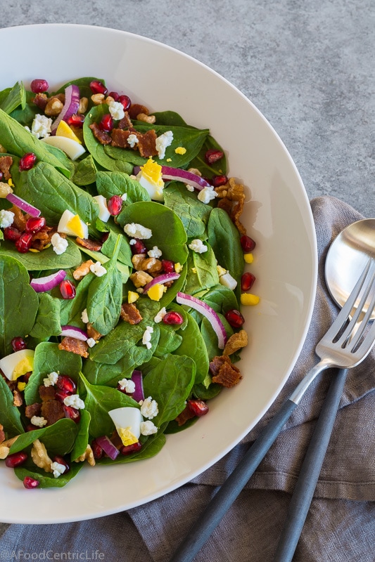 colorful spinach salad with pomegranate.