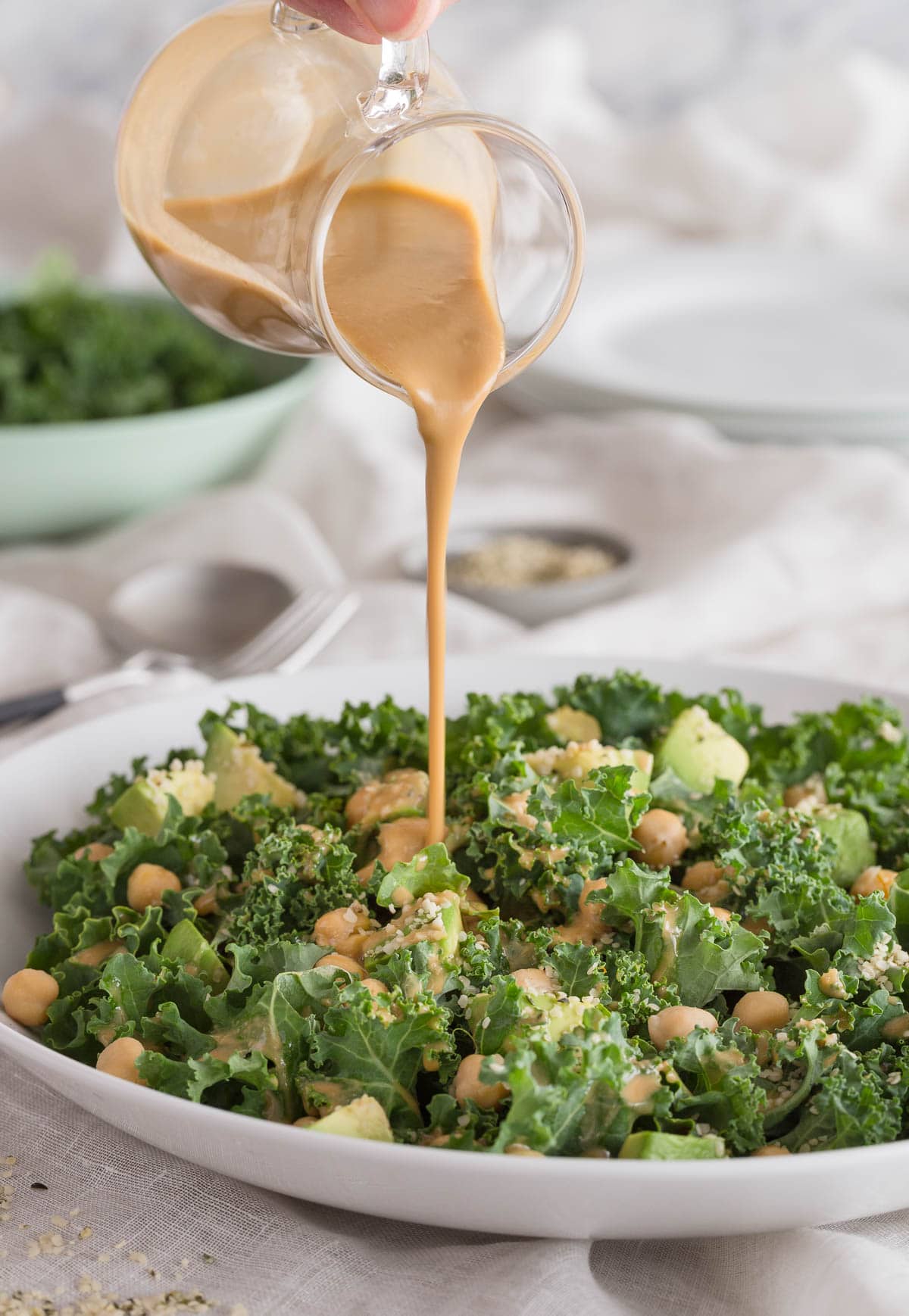 A curly kale salad with chickpeas and creamy tahini dressing.