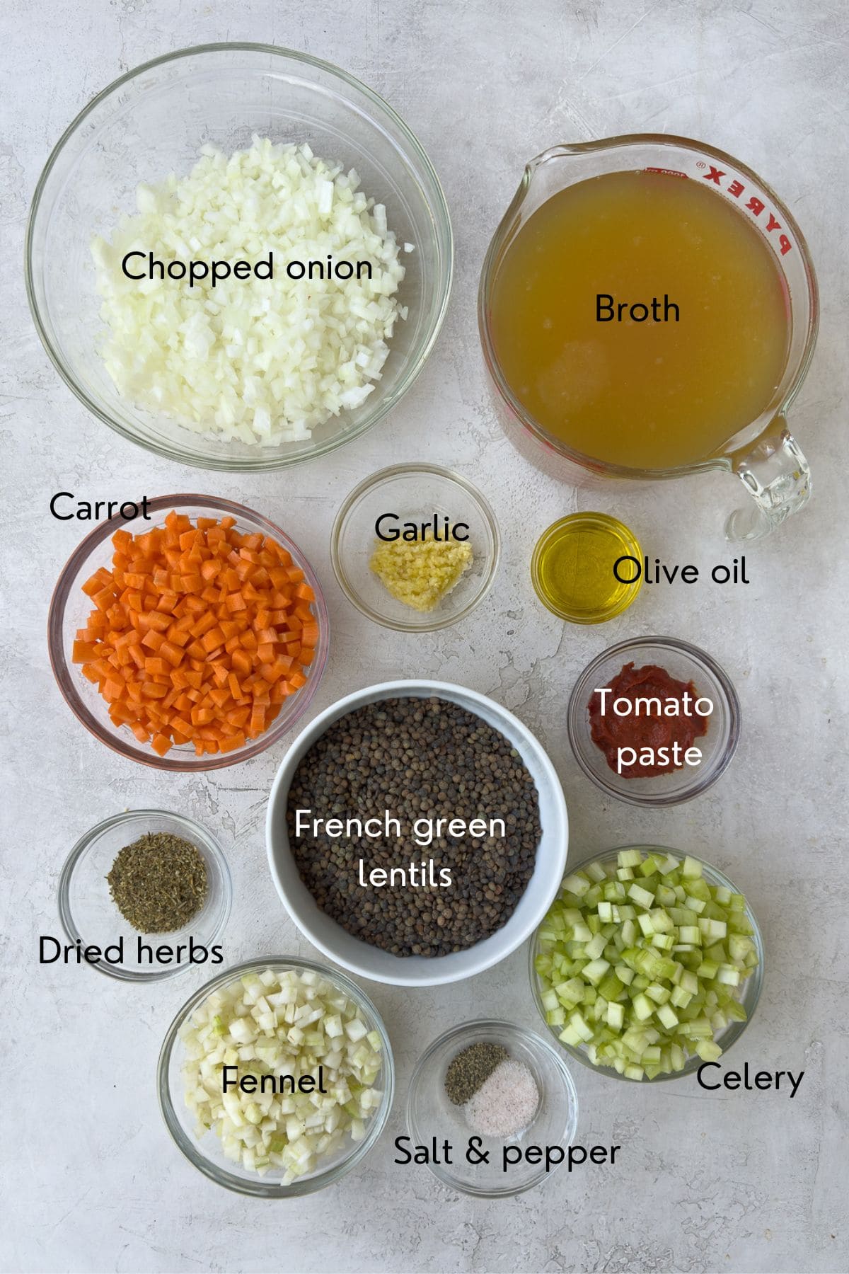 Ingredients for lentil soup with labels on a counter top.