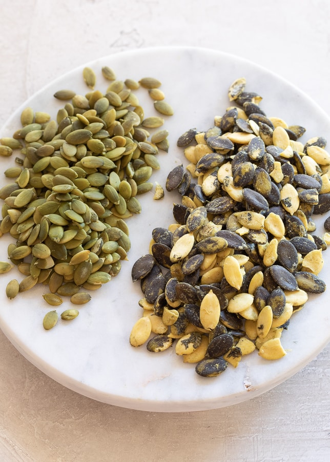 Two kinds of raw pumpkin seeds.