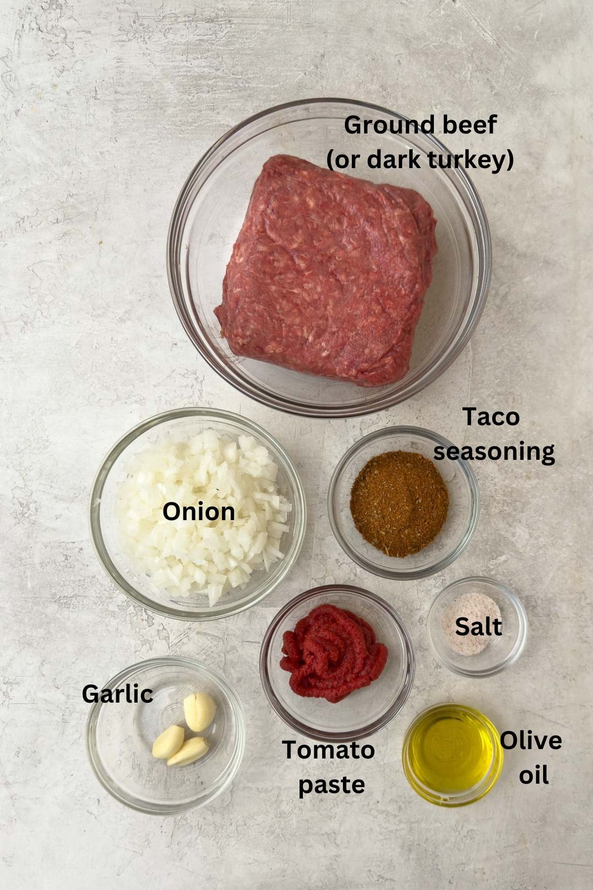 Simple ingredients for taco meat with ground beef.