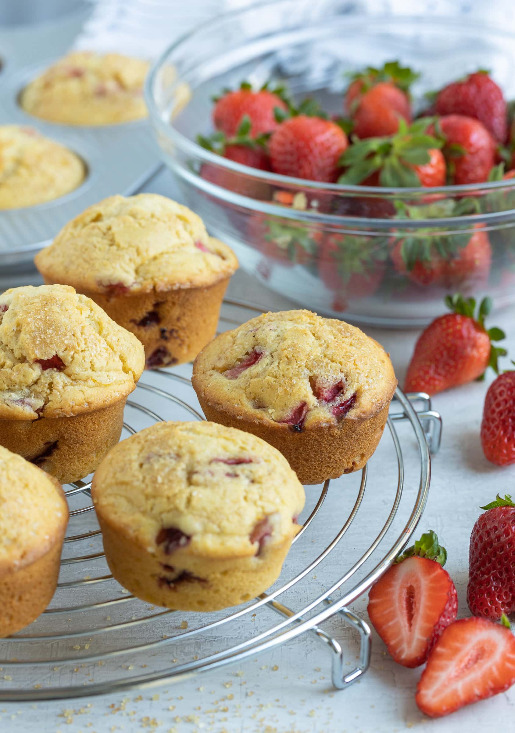 Gluten free strawberry muffins on a cooling rack.