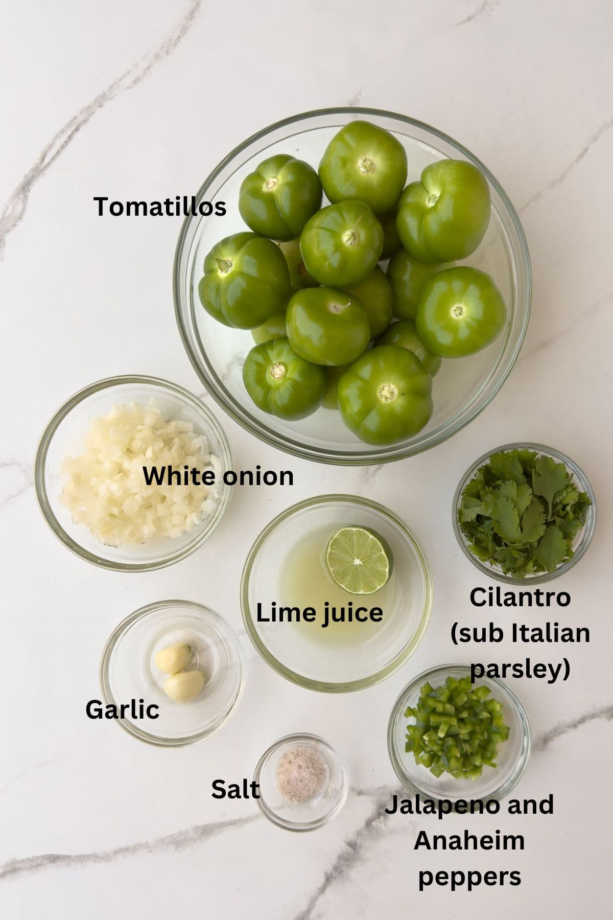 Ingredients for salsa verde in bowls on the counter. 