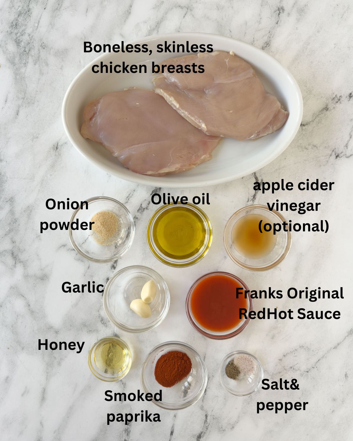 Ingredients for a buffalo chicken salad and marinade in small glass prep bowls