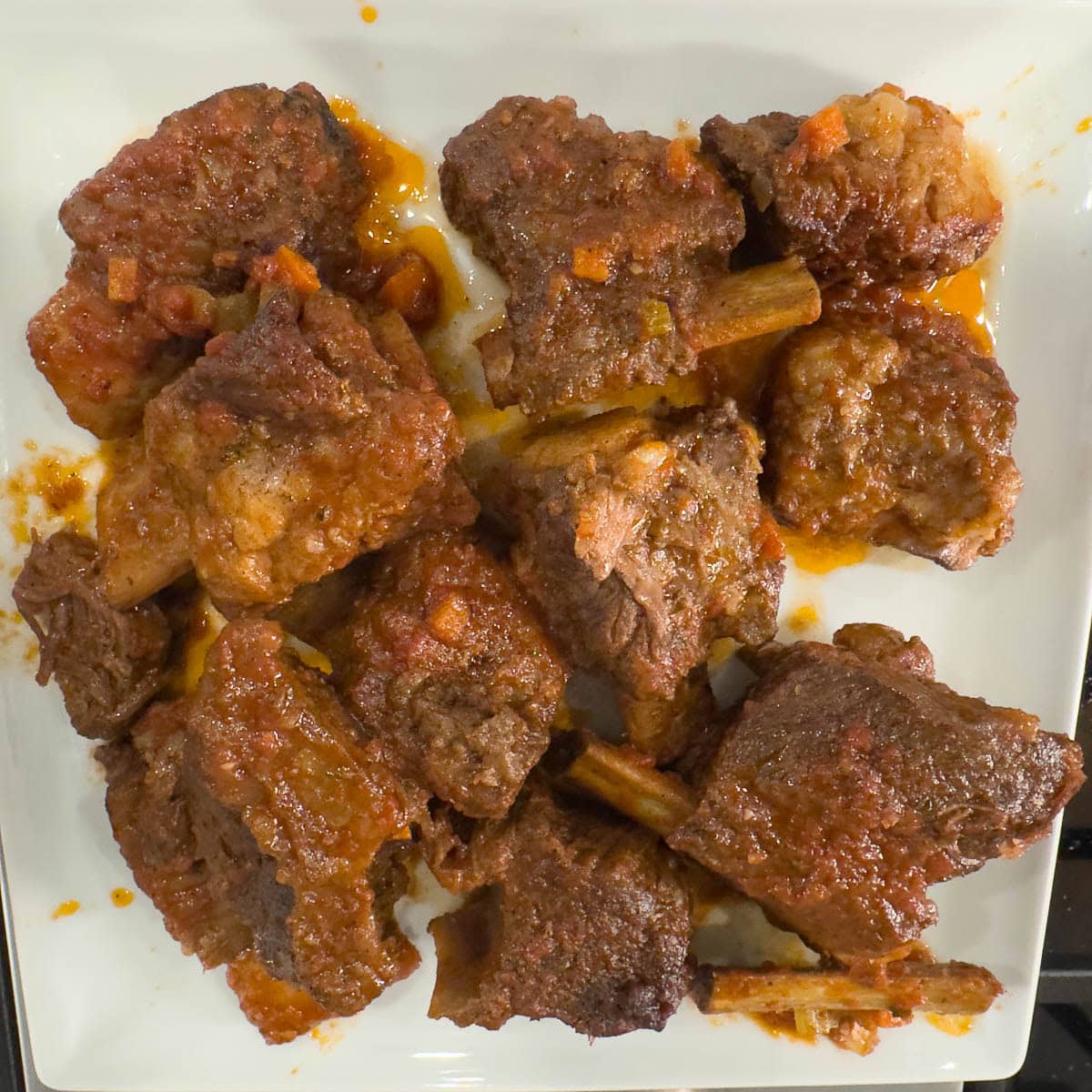 A plate of braised beef short ribs waiting for the next step.