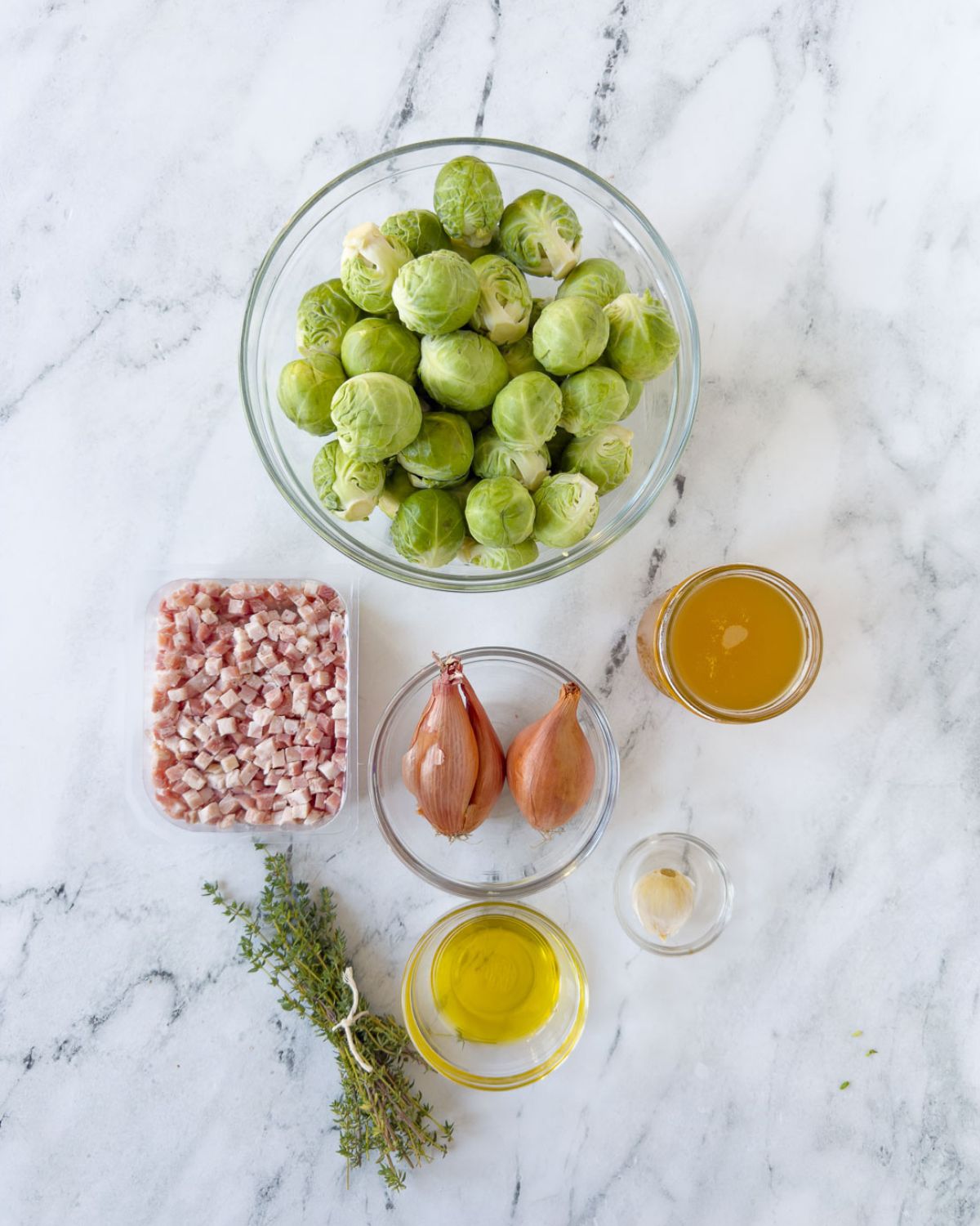 Brussels sprouts, pancetta, broth, herbs, and oil to make Brussels Sprouts with Pancetta. 