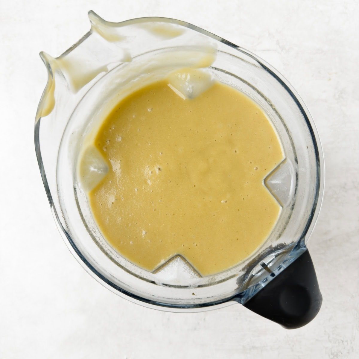 Pureed leek and potato soup without cream in a blender container.