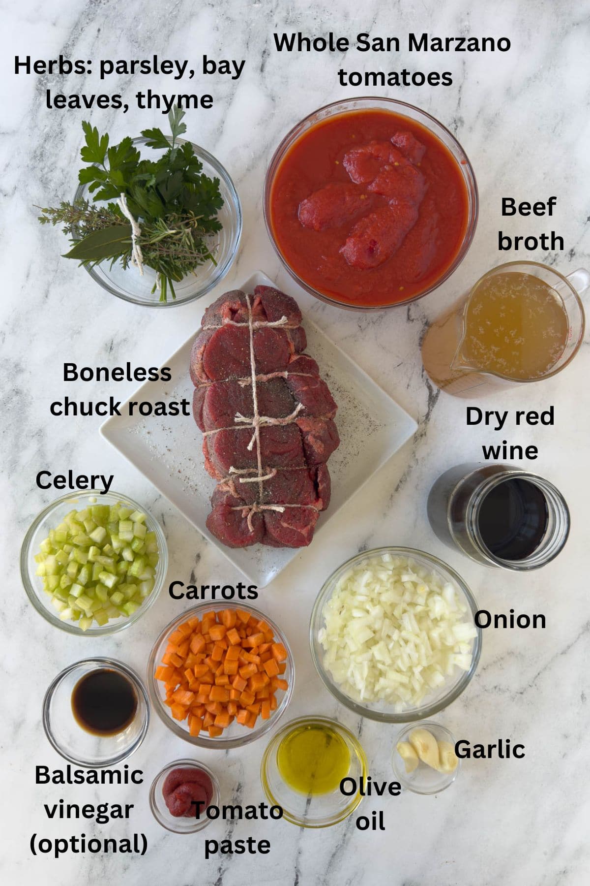 Ingredients for Italian stracotto (pot roast) in prep bowls on the kitchen counter. 