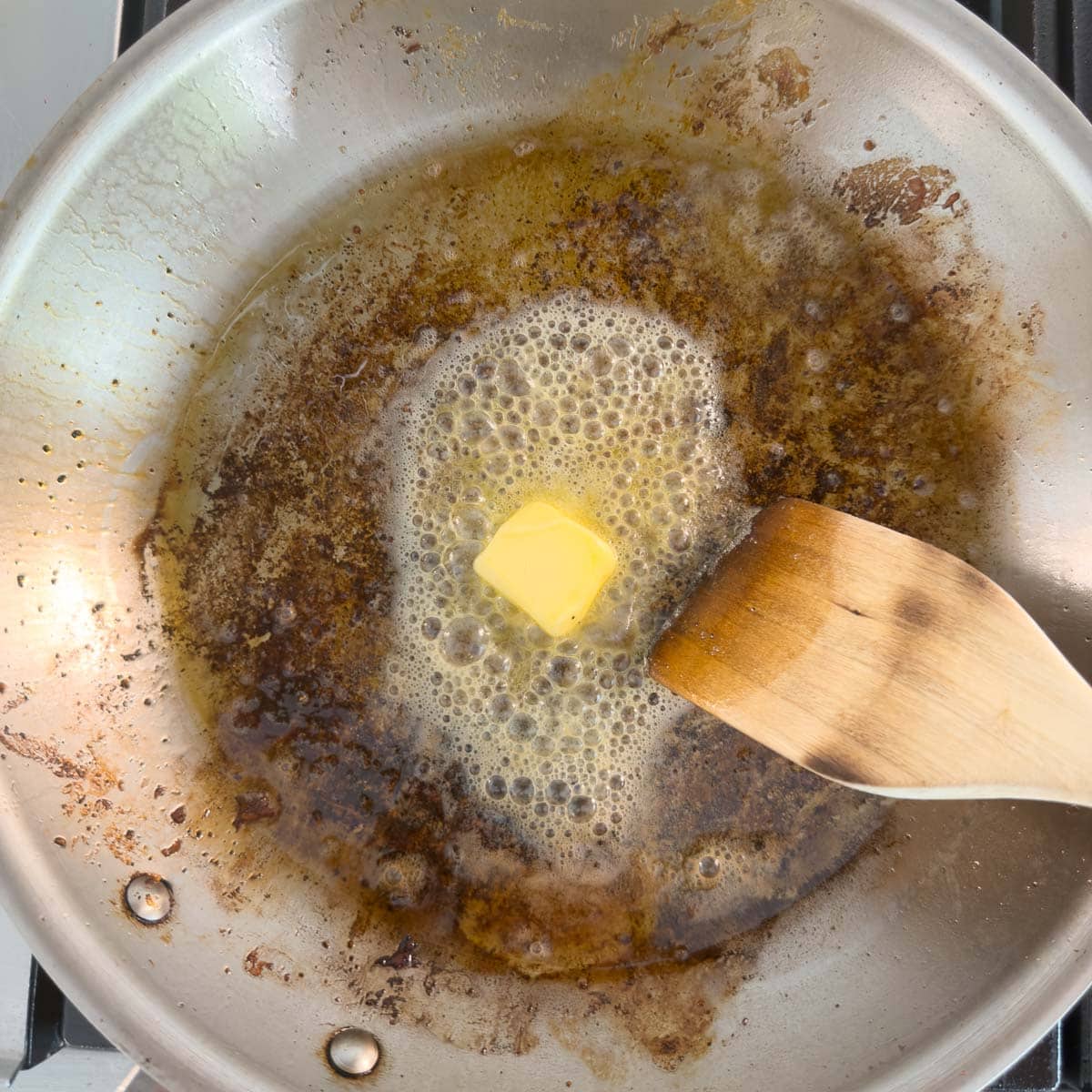 Adding butter to a skillet with lots of brown bits called fond.